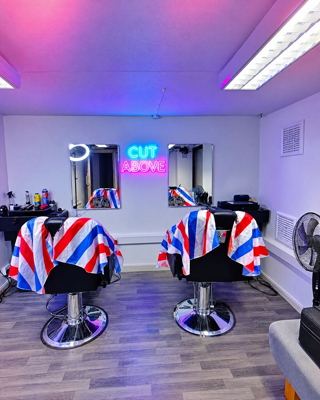 Both chairs draped in red, white and blue striped capes